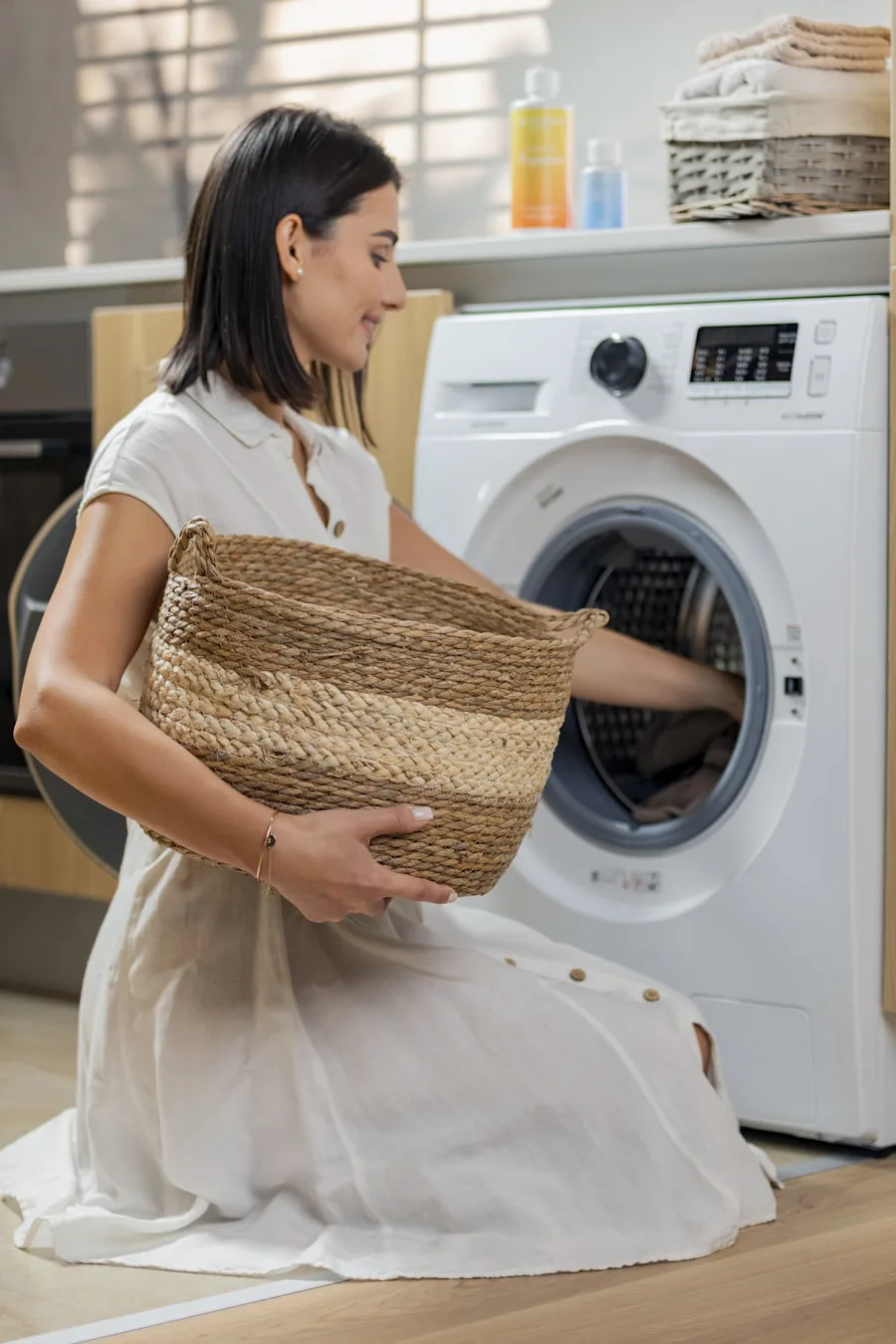 A Zippidobi MOM partner smiling while neatly folding fresh laundry